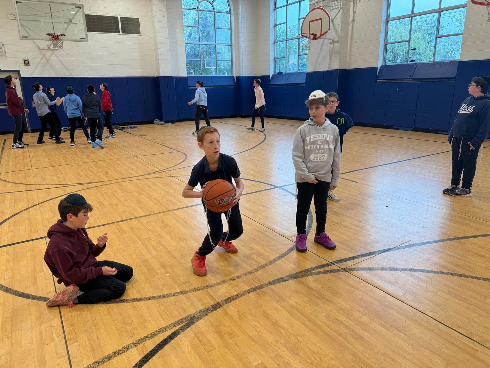 Boys with a basketball in the gym
